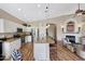 Open kitchen boasts a granite island, stainless appliances, and seamless flow to living spaces at 9706 E Sheena Dr, Scottsdale, AZ 85260