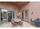 Covered patio with dining set and barbecue, great for outdoor entertaining at 9706 E Sheena Dr, Scottsdale, AZ 85260