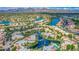 An aerial view of an upscale waterfront community with stunning mountain views in the distance at 10015 E Mountain View Rd # 2010, Scottsdale, AZ 85258