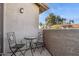 Cozy balcony area with decorative table and chairs and views of the surrounding community at 10015 E Mountain View Rd # 2010, Scottsdale, AZ 85258