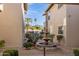 Charming courtyard features a decorative fountain and lush desert landscaping with mountain views in the distance at 10015 E Mountain View Rd # 2010, Scottsdale, AZ 85258