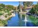 Picturesque pond with fountains, lush landscaping, walking paths, and inviting lounge areas at 10015 E Mountain View Rd # 2010, Scottsdale, AZ 85258