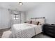 Comfortable bedroom with white walls, wood floors, and modern decor at 10865 E Florian Ave, Mesa, AZ 85208