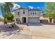 Inviting two-story home featuring a neutral color palette, well-maintained landscaping, and a spacious two car garage at 10865 E Florian Ave, Mesa, AZ 85208
