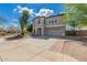 Beautiful home with a well-maintained front yard, driveway, and charming curb appeal at 10865 E Florian Ave, Mesa, AZ 85208