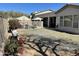 Expansive backyard with a pool, patio, and lush landscaping, perfect for outdoor living at 10980 E Winchcomb Dr, Scottsdale, AZ 85255