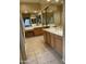 Bright bathroom featuring double sink vanity and large vanity mirror at 10980 E Winchcomb Dr, Scottsdale, AZ 85255