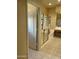 Bright bathroom featuring glass enclosed tub/shower and double sink vanity at 10980 E Winchcomb Dr, Scottsdale, AZ 85255