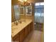 Bathroom boasts a double sink vanity with cabinets and a shower/toilet room with tiled walls at 10980 E Winchcomb Dr, Scottsdale, AZ 85255
