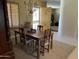 Cozy dining room features a wood table with seating for four and a decorative chandelier at 10980 E Winchcomb Dr, Scottsdale, AZ 85255