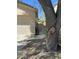 Side view of a home with an attached garage and drought-tolerant landscaping at 10980 E Winchcomb Dr, Scottsdale, AZ 85255