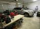 Well-organized garage featuring multiple vehicles and storage options, providing secure parking and utility space at 10980 E Winchcomb Dr, Scottsdale, AZ 85255