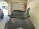 Garage interior showcasing a parked car with the garage door open at 10980 E Winchcomb Dr, Scottsdale, AZ 85255