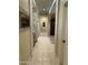 Hallway view showing tiled flooring, accent wall and open floorplan at 10980 E Winchcomb Dr, Scottsdale, AZ 85255
