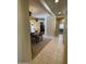 Inviting hallway leading to a dining area and other rooms, featuring tile flooring at 10980 E Winchcomb Dr, Scottsdale, AZ 85255