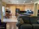 Spacious kitchen boasts ample cabinetry, black appliances, island, and breakfast nook at 10980 E Winchcomb Dr, Scottsdale, AZ 85255