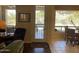 Open Living Room with backyard access and views of swimming pool at 10980 E Winchcomb Dr, Scottsdale, AZ 85255