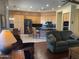 Inviting living room with stone accent wall, fireplace, and wood flooring at 10980 E Winchcomb Dr, Scottsdale, AZ 85255