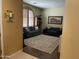 Inviting living room with comfortable seating, hardwood floors, and a large decorative rug at 10980 E Winchcomb Dr, Scottsdale, AZ 85255