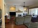 Comfortable living room featuring a stone accent wall, fireplace, and modern furnishings at 10980 E Winchcomb Dr, Scottsdale, AZ 85255