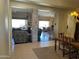 Open-concept living spaces connecting the dining and living areas in a bright layout at 10980 E Winchcomb Dr, Scottsdale, AZ 85255