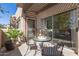 Cozy balcony setup with seating and a table, extending indoor living space at 11260 N 92Nd St # 2023, Scottsdale, AZ 85260