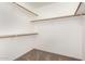 Walk-in closet boasting wood shelving, providing ample and organized storage at 11260 N 92Nd St # 2023, Scottsdale, AZ 85260