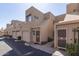 Exterior view of a townhome showcasing its desert landscaping, private garages, and modern architecture at 11260 N 92Nd St # 2023, Scottsdale, AZ 85260