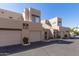 Condo exterior with garage and entry, showcasing desert landscaping and unit numbers at 11260 N 92Nd St # 2023, Scottsdale, AZ 85260
