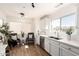 Well-lit kitchen area with stainless steel appliances, stylish seating area and a large window at 11260 N 92Nd St # 2023, Scottsdale, AZ 85260