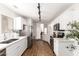 Kitchen features white cabinets, stainless steel appliances, and laminate flooring for a clean look at 11260 N 92Nd St # 2023, Scottsdale, AZ 85260