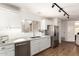 Updated kitchen with quartz counters, white cabinets, stainless appliances and wood-look floors at 11260 N 92Nd St # 2023, Scottsdale, AZ 85260