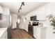 Charming kitchen featuring updated cabinets, stainless steel appliances, laminate flooring and stylish lighting at 11260 N 92Nd St # 2023, Scottsdale, AZ 85260