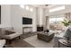 Sunlit living room boasting a fireplace, balcony access, and contemporary furnishings at 11260 N 92Nd St # 2023, Scottsdale, AZ 85260