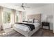 Well-lit main bedroom with large windows, a ceiling fan, and tasteful decor at 11260 N 92Nd St # 2023, Scottsdale, AZ 85260