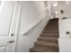 Carpeted staircase leading upstairs, complemented by fresh white walls, trim, and natural light at 11260 N 92Nd St # 2023, Scottsdale, AZ 85260