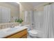 Bathroom features a bright vanity, a standard toilet, and a tub shower with curtain at 1285 E Cottonwood Rd, San Tan Valley, AZ 85140