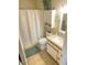 Bright bathroom featuring a shower-tub combination with a white shower curtain and tile floors at 13807 N Garden Ct Dr, Sun City, AZ 85351