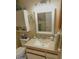 Bathroom with a large vanity and mirror, white cabinets, and a toilet at 13807 N Garden Ct Dr, Sun City, AZ 85351