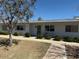 Charming single-story home with well-maintained landscaping and a cozy front entrance at 13807 N Garden Ct Dr, Sun City, AZ 85351