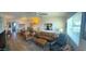 Open living room featuring comfortable seating, a dining area, and bright natural light at 13807 N Garden Ct Dr, Sun City, AZ 85351