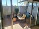 A cozy patio with comfortable chairs, a bicycle, and decorative elements at 13807 N Garden Ct Dr, Sun City, AZ 85351