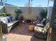 Cozy patio with comfortable seating and garden decorations at 13807 N Garden Ct Dr, Sun City, AZ 85351