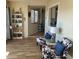 Relaxing sitting room featuring stylish chairs, wood floors, and soft natural light at 13807 N Garden Ct Dr, Sun City, AZ 85351