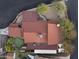 Aerial view of a home featuring a putting green, lush landscaping, and a distinct red roof at 1422 E Royal Palm Rd, Phoenix, AZ 85020
