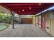 Landscaped backyard featuring a covered area, a metal gate, and a charming putting green at 1422 E Royal Palm Rd, Phoenix, AZ 85020