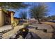 Backyard featuring desert landscaping, a fire pit, and a seating area at 1422 E Royal Palm Rd, Phoenix, AZ 85020