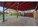 Backyard featuring a rock garden, a putting green, and a covered pergola with decorative string lights at 1422 E Royal Palm Rd, Phoenix, AZ 85020