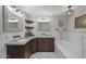 Stylish bathroom features a double sink vanity and a soaking tub at 1422 E Royal Palm Rd, Phoenix, AZ 85020
