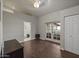 Bright bedroom with hardwood floors, closet, and doors to the outdoor space and ensuite bathroom at 1422 E Royal Palm Rd, Phoenix, AZ 85020
